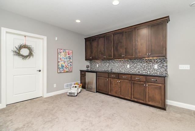 1621 Dutch Lake Dr, Minnetrista, MN 55364 - kitchen featuring light colored carpet, fridge, dark brown cabinets, and recessed lighting