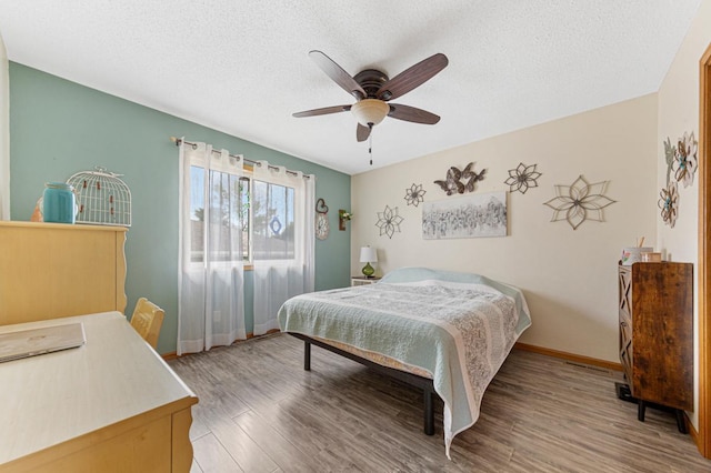 2115 Turpin St, Saint Peter, MN 56082 - bedroom featuring light wood-style floors, a textured ceiling, and ceiling fan