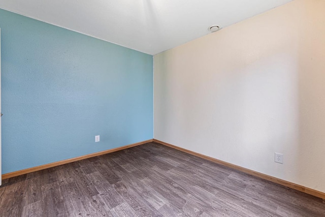 2115 Turpin St, Saint Peter, MN 56082 - spare room featuring dark wood-style floors and baseboards