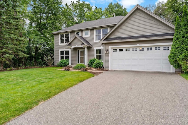 5245 Dufferin Dr, Savage, MN 55378 - view of front of property with asphalt driveway, a garage, and a front yard