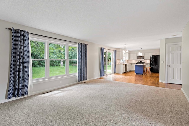 5245 Dufferin Dr, Savage, MN 55378 - unfurnished living room with light carpet and baseboards