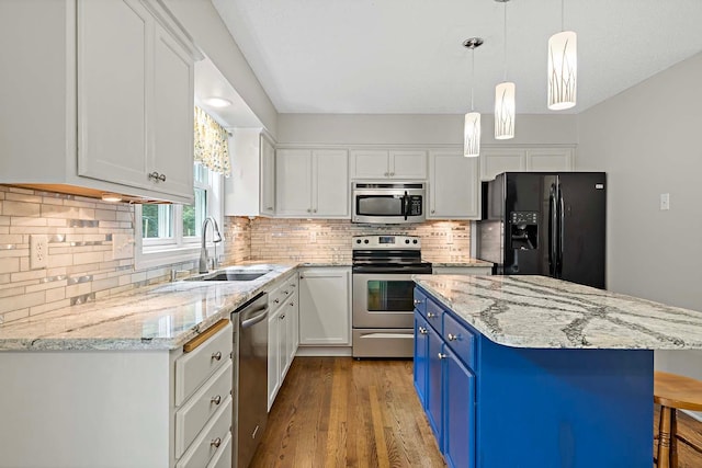 5245 Dufferin Dr, Savage, MN 55378 - kitchen featuring appliances with stainless steel finishes, blue cabinets, light wood finished floors, and white cabinets