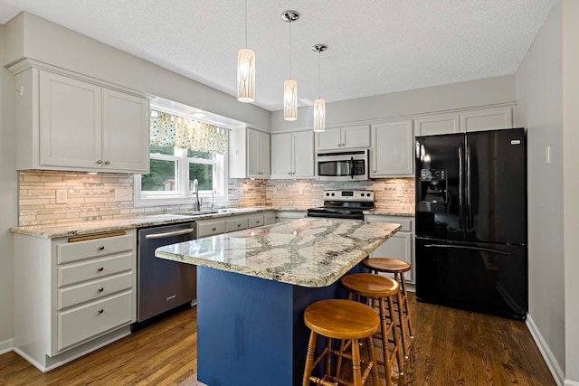 5245 Dufferin Dr, Savage, MN 55378 - kitchen with black appliances, dark wood-style floors, a textured ceiling, and backsplash