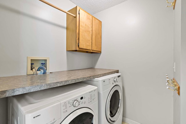 5245 Dufferin Dr, Savage, MN 55378 - laundry area with cabinet space, independent washer and dryer, and a textured ceiling