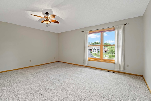 5245 Dufferin Dr, Savage, MN 55378 - empty room with light carpet, a ceiling fan, and a textured ceiling