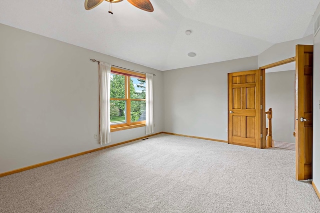 5245 Dufferin Dr, Savage, MN 55378 - carpeted spare room featuring ceiling fan, vaulted ceiling, and a textured ceiling