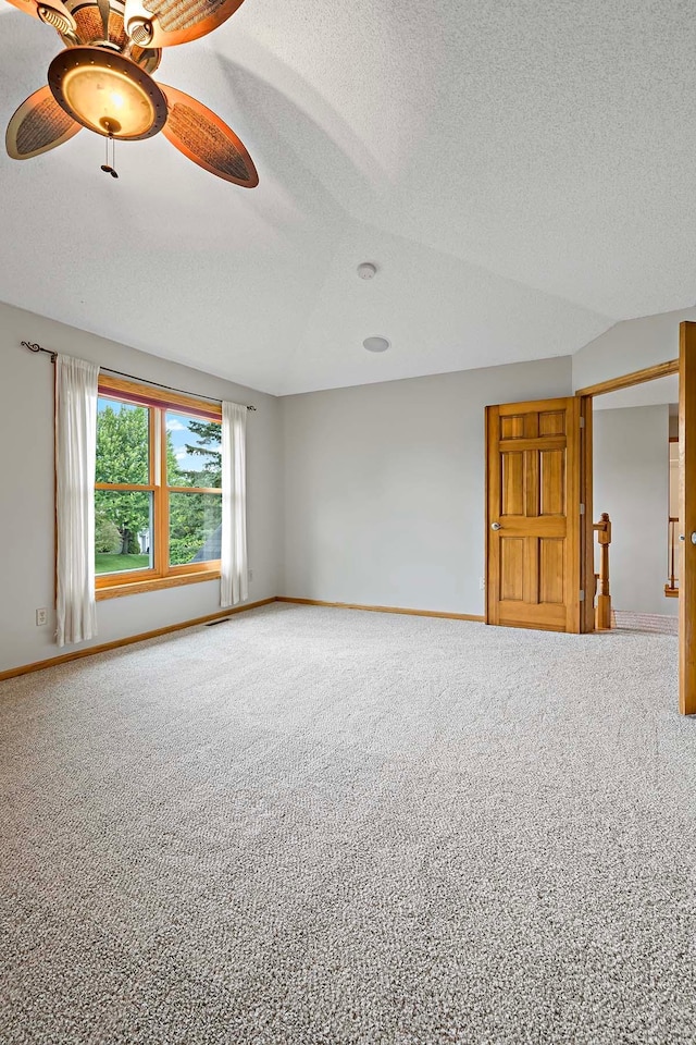 5245 Dufferin Dr, Savage, MN 55378 - spare room featuring a textured ceiling, carpet, and a ceiling fan