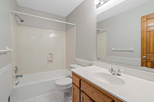 5245 Dufferin Dr, Savage, MN 55378 - full bath with vanity, tub / shower combination, tile patterned floors, a textured ceiling, and a wainscoted wall