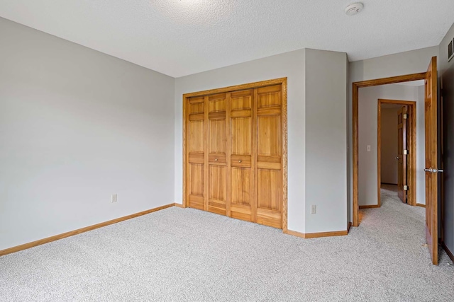 5245 Dufferin Dr, Savage, MN 55378 - unfurnished bedroom with carpet, a closet, and a textured ceiling