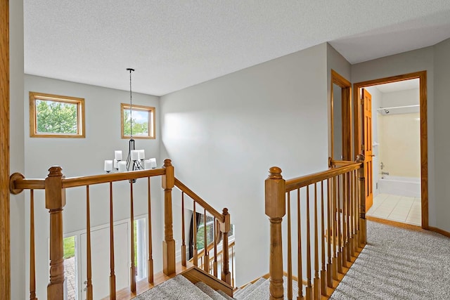 5245 Dufferin Dr, Savage, MN 55378 - staircase with a textured ceiling