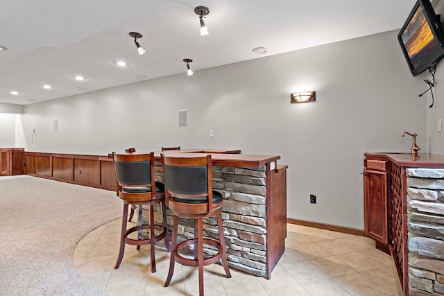 5245 Dufferin Dr, Savage, MN 55378 - indoor dry bar with recessed lighting and light tile patterned floors