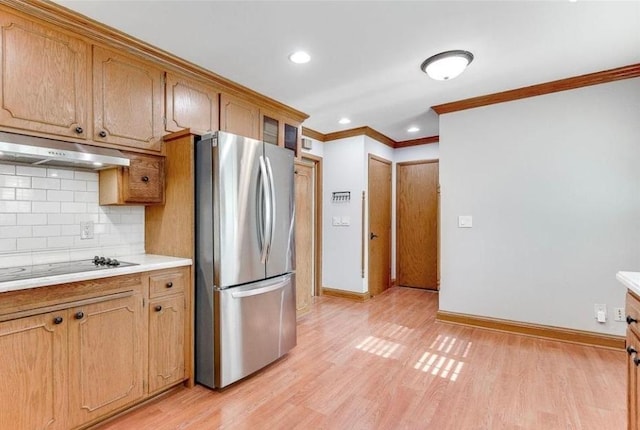 6325 Brookview Ave, Edina, MN 55424 - kitchen with freestanding refrigerator, under cabinet range hood, crown molding, backsplash, and light countertops