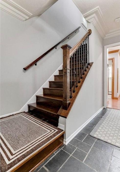 6325 Brookview Ave, Edina, MN 55424 - staircase with crown molding and baseboards