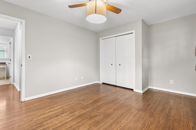 6325 Brookview Ave, Edina, MN 55424 - unfurnished bedroom with wood finished floors, a closet, and a ceiling fan