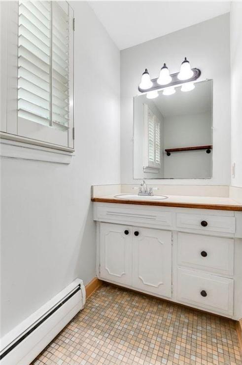 6325 Brookview Ave, Edina, MN 55424 - bathroom with a baseboard radiator and vanity