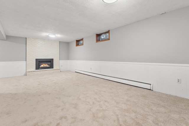 6325 Brookview Ave, Edina, MN 55424 - finished below grade area featuring a baseboard radiator, a textured ceiling, carpet floors, a wainscoted wall, and a fireplace
