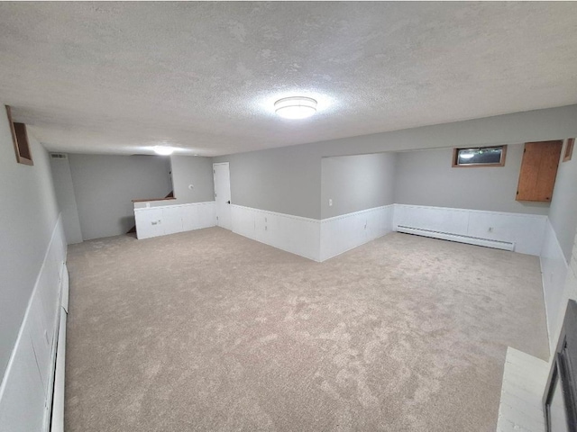 6325 Brookview Ave, Edina, MN 55424 - finished basement featuring a baseboard heating unit, carpet flooring, and a textured ceiling