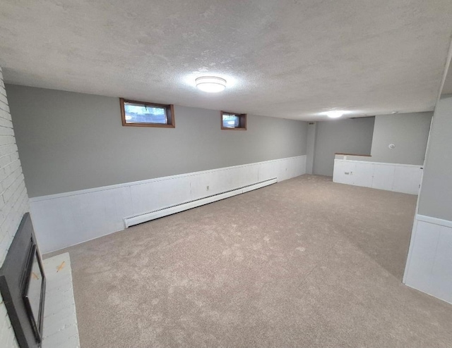 6325 Brookview Ave, Edina, MN 55424 - below grade area with a baseboard radiator, carpet floors, a textured ceiling, and wainscoting