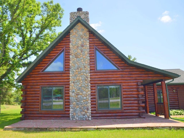 17771 State 34, Park Rapids, MN 56470 - back of property featuring log siding and a chimney