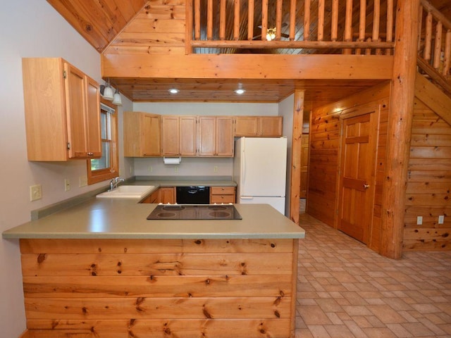 17771 State 34, Park Rapids, MN 56470 - kitchen with freestanding refrigerator, a peninsula, light brown cabinets, stovetop, and black dishwasher