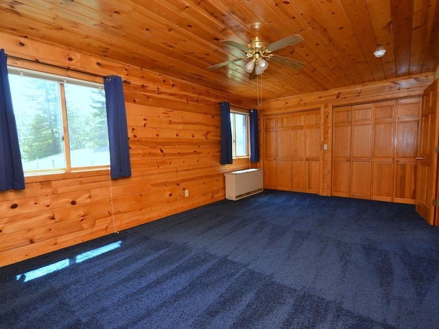 17771 State 34, Park Rapids, MN 56470 - unfurnished bedroom with multiple windows, dark carpet, wood ceiling, and wooden walls
