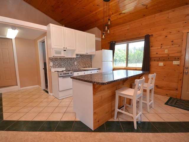 17771 State 34, Park Rapids, MN 56470 - kitchen with white appliances, vaulted ceiling, light tile patterned floors, wood ceiling, and decorative backsplash