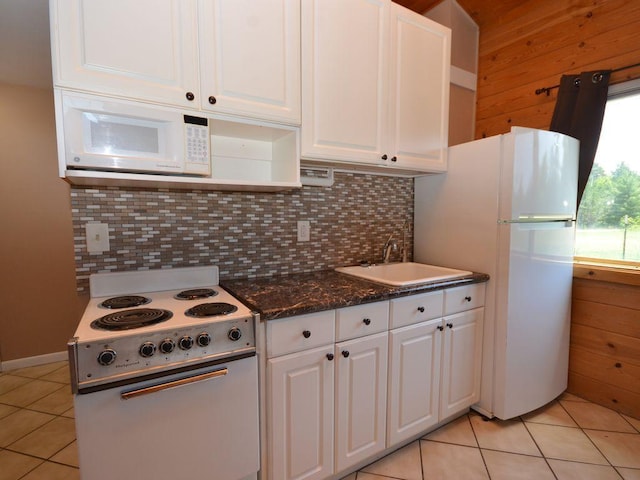 17771 State 34, Park Rapids, MN 56470 - kitchen with white appliances, light tile patterned floors, white cabinetry, and decorative backsplash