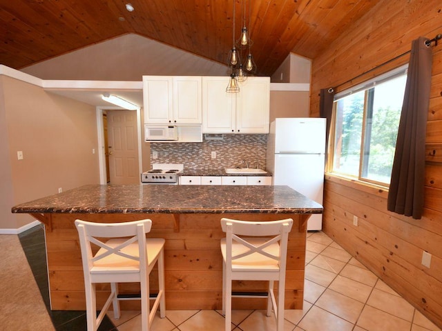17771 State 34, Park Rapids, MN 56470 - kitchen featuring white appliances, vaulted ceiling, wooden ceiling, white cabinetry, and decorative backsplash