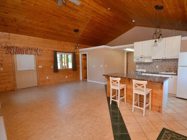 17771 State 34, Park Rapids, MN 56470 - kitchen with white appliances, wood ceiling, wood walls, a kitchen island, and tasteful backsplash