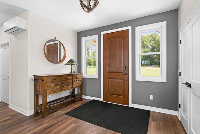 4335 Spring View Dr, Moose Lake, MN 55767 - entrance foyer featuring a wall mounted AC, dark wood finished floors, and plenty of natural light
