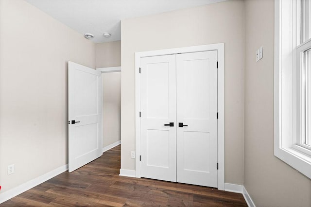 4335 Spring View Dr, Moose Lake, MN 55767 - unfurnished bedroom featuring dark wood finished floors and a closet