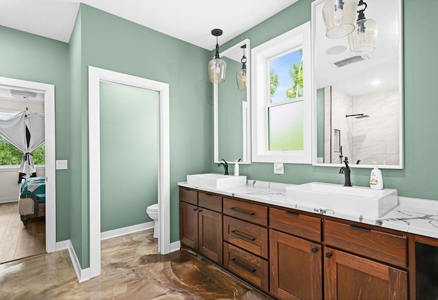 4335 Spring View Dr, Moose Lake, MN 55767 - bathroom featuring double vanity, plenty of natural light, tiled shower, and ensuite bath