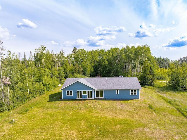 4335 Spring View Dr, Moose Lake, MN 55767 - view of front facade featuring a wooded view and a front yard