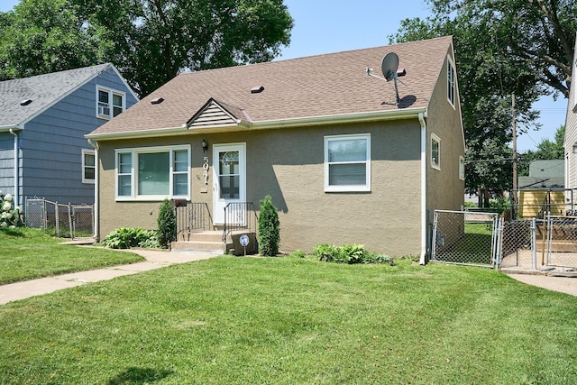 5041 Upton Ave N, Minneapolis, MN 55430 - view of front of home featuring a gate, stucco siding, and a shingled roof