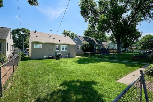 5041 Upton Ave N, Minneapolis, MN 55430 - rear view of property with a fenced backyard and stucco siding