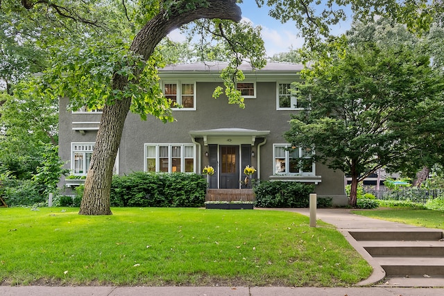 4626 Dupont Ave S, Minneapolis, MN 55419 - colonial-style house with a front yard and stucco siding