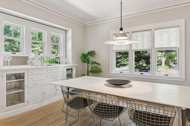 4626 Dupont Ave S, Minneapolis, MN 55419 - dining room with light wood-type flooring, ornamental molding, and healthy amount of natural light