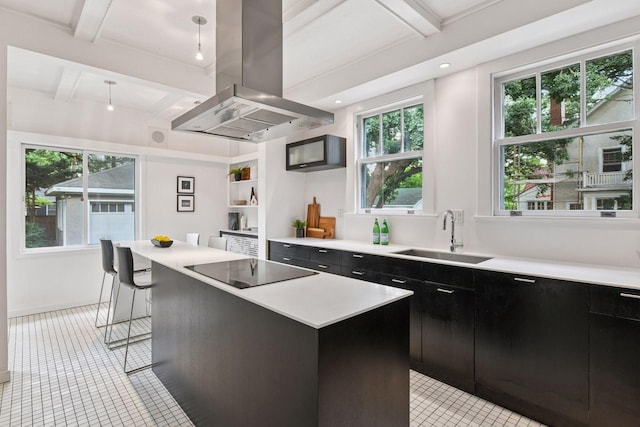 4626 Dupont Ave S, Minneapolis, MN 55419 - kitchen featuring island range hood, black electric cooktop, dark cabinets, light countertops, and beamed ceiling
