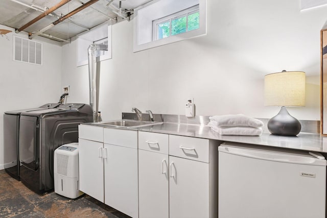 4626 Dupont Ave S, Minneapolis, MN 55419 - laundry area with cabinet space and washer and clothes dryer