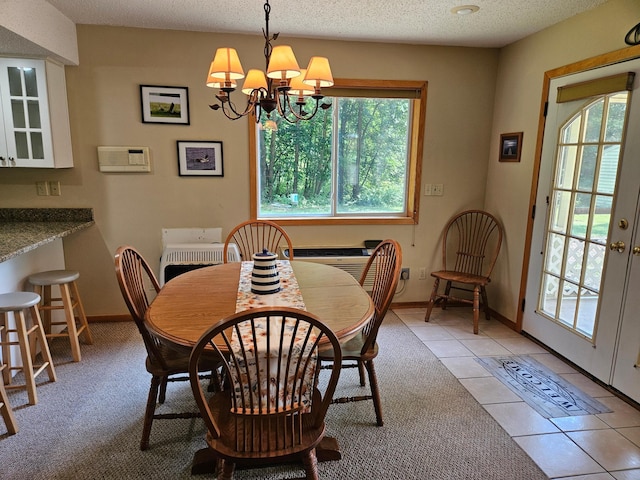 42674 305th Pl, Aitkin, MN 56431 - dining room featuring a chandelier, light tile patterned flooring, and a textured ceiling