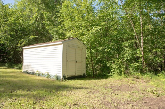 42674 305th Pl, Aitkin, MN 56431 - view of shed featuring a forest view