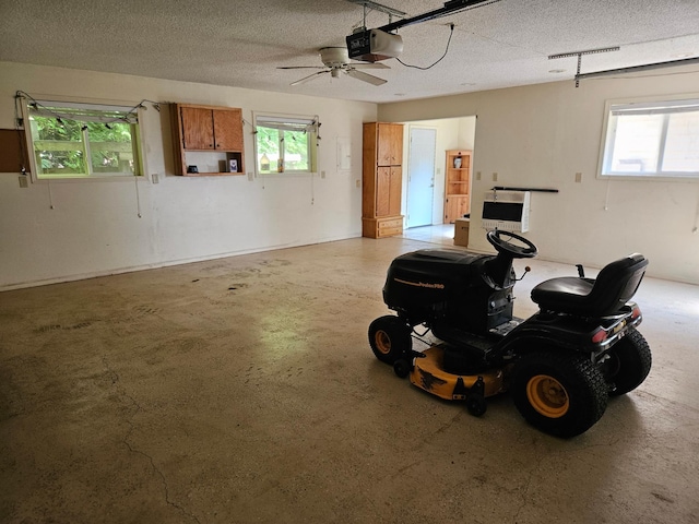 42674 305th Pl, Aitkin, MN 56431 - garage featuring a garage door opener and ceiling fan
