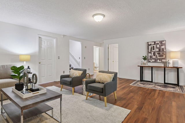 913 Carriage Ln, Chaska, MN 55318 - living area featuring stairway, wood finished floors, and a textured ceiling