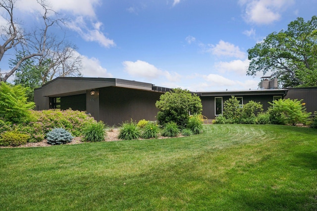 5962 Hobe Ln, White Bear Twp, MN 55110 - view of home's exterior with a lawn
