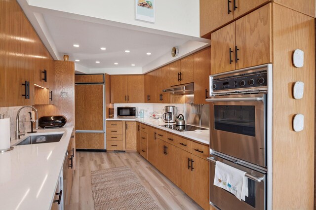 5962 Hobe Ln, White Bear Twp, MN 55110 - kitchen featuring stainless steel appliances, decorative backsplash, light wood-type flooring, light countertops, and recessed lighting