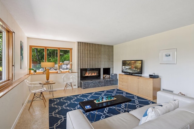 5962 Hobe Ln, White Bear Twp, MN 55110 - living area with a fireplace and speckle patterned floor