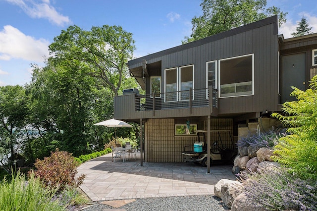 5962 Hobe Ln, White Bear Twp, MN 55110 - view of front of house featuring a patio area and a balcony