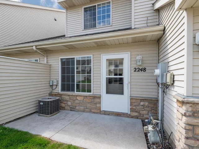 2248 Affirmed Dr, Shakopee, MN 55379 - entrance to property with a patio and stone siding