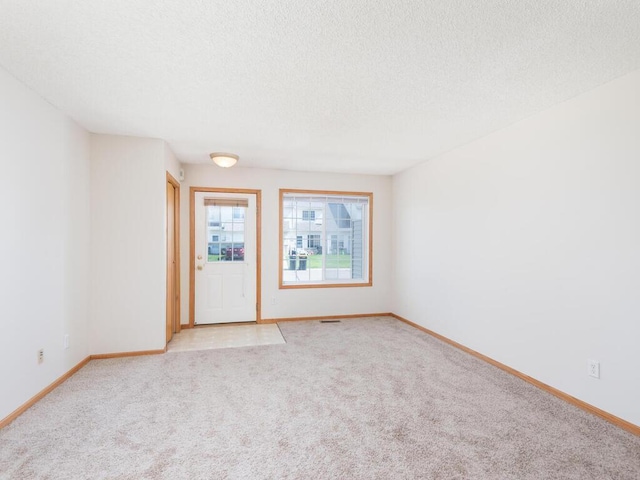 2248 Affirmed Dr, Shakopee, MN 55379 - unfurnished room with a textured ceiling and light carpet