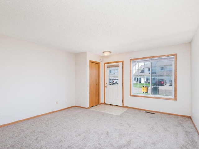 2248 Affirmed Dr, Shakopee, MN 55379 - empty room with light colored carpet and a textured ceiling
